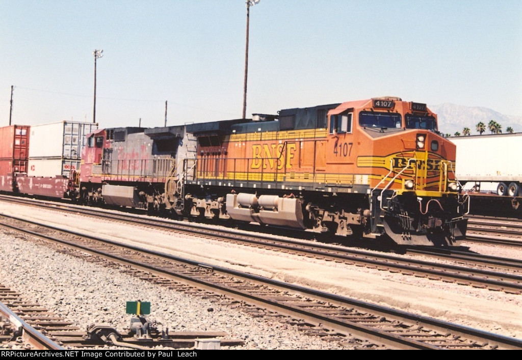 Eastbound stack train cruises past the station